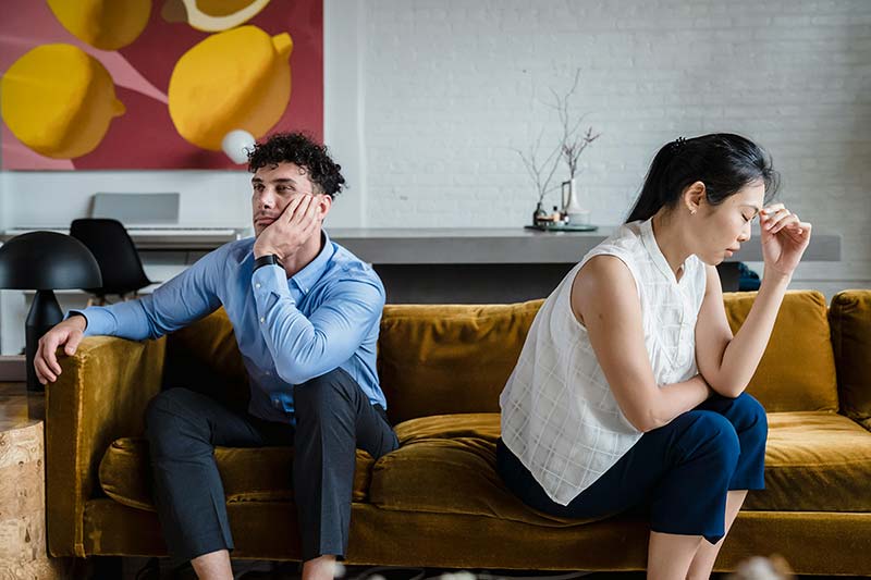 head-to-heart-article-revitalizing-your-marriage-picture-of-unhappy-couple-sitting-on-sofa