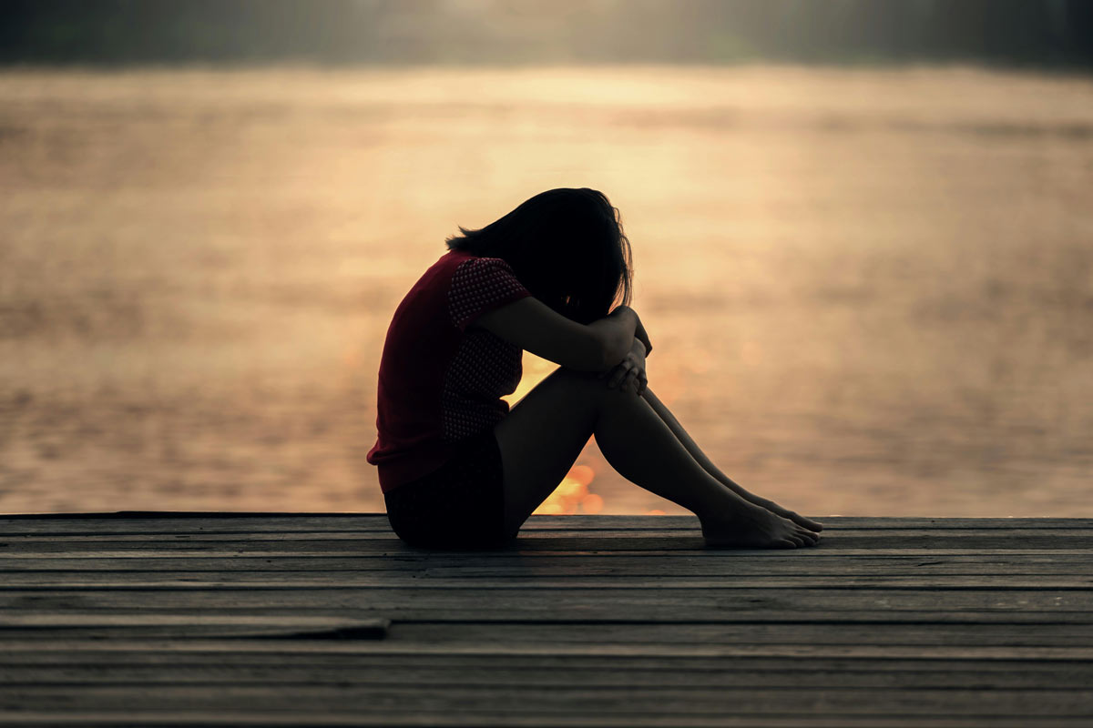 head-to-heart-restoration-ministry-moments-with-al-called-to-relationship-article-image-of-an-woman-sitting-on-a-dock-by-a-lake