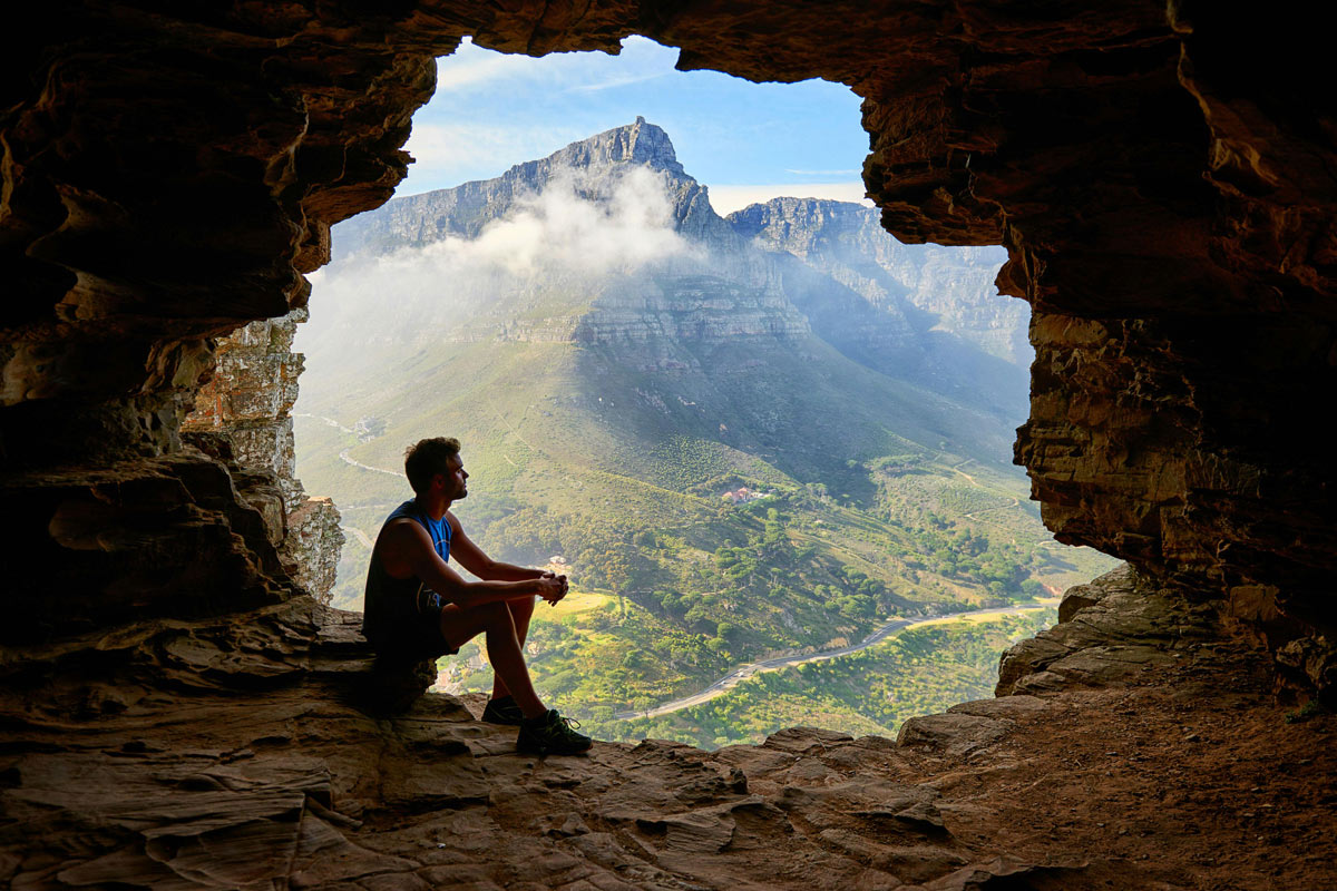 head-to-heart-restoration-ministry-moments-with-al-called-to-relationship-article-image-of-man-sitting-in-a-cave-looking-at-a-valley